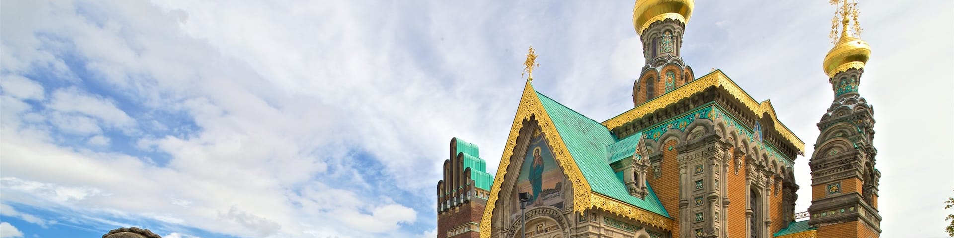 Russian Chapel which includes heritage architecture and a church or cathedral as well as a small group of people