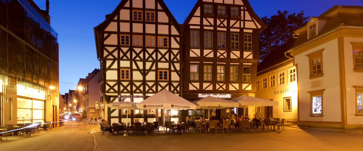 Erfurt which includes night scenes, heritage elements and outdoor eating