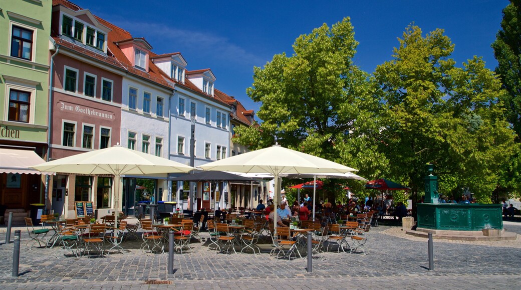 Weimar featuring outdoor eating as well as a small group of people