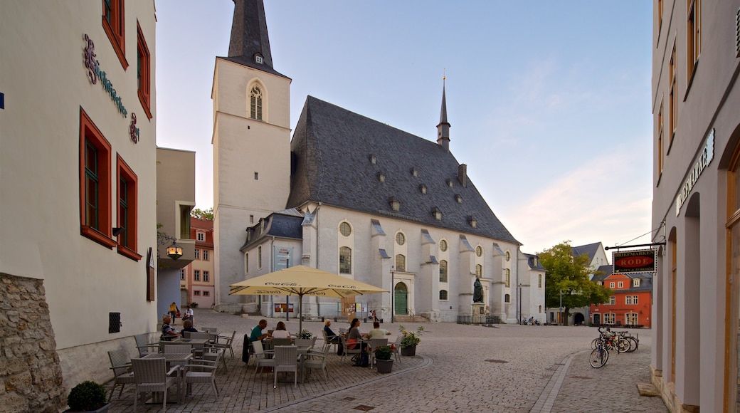 Stadtkirche St Peter und Paul which includes heritage architecture, a sunset and outdoor eating