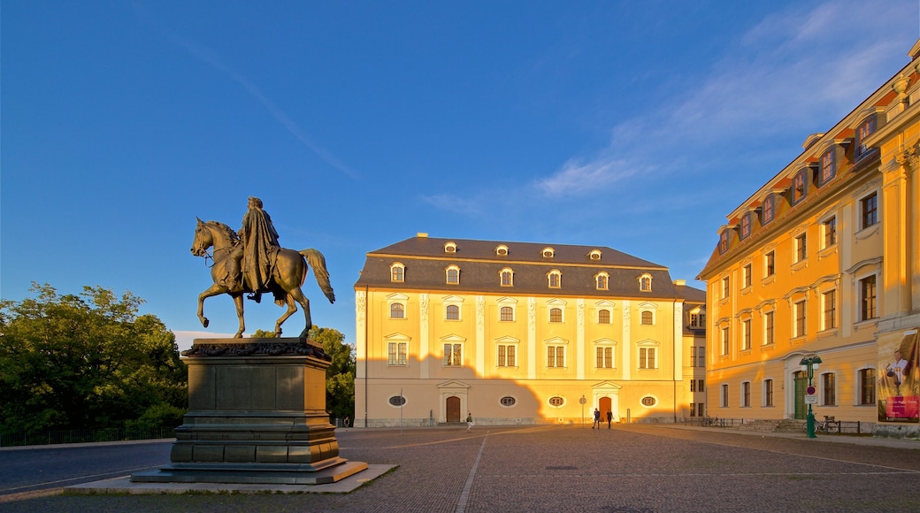 Weimar showing a statue or sculpture, a sunset and heritage elements