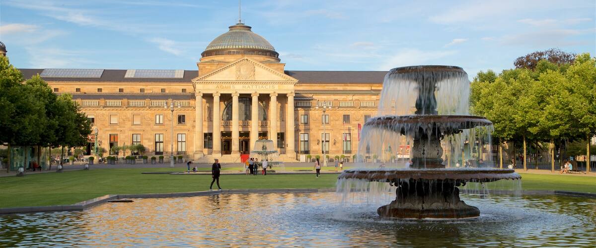 Kurhaus which includes a fountain, heritage architecture and a garden