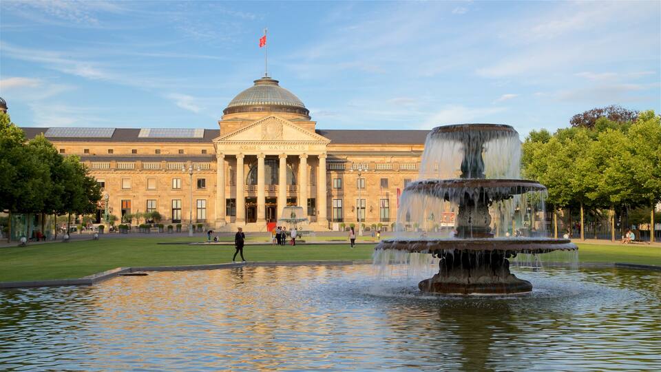 Kurhaus featuring a fountain, a garden and heritage architecture