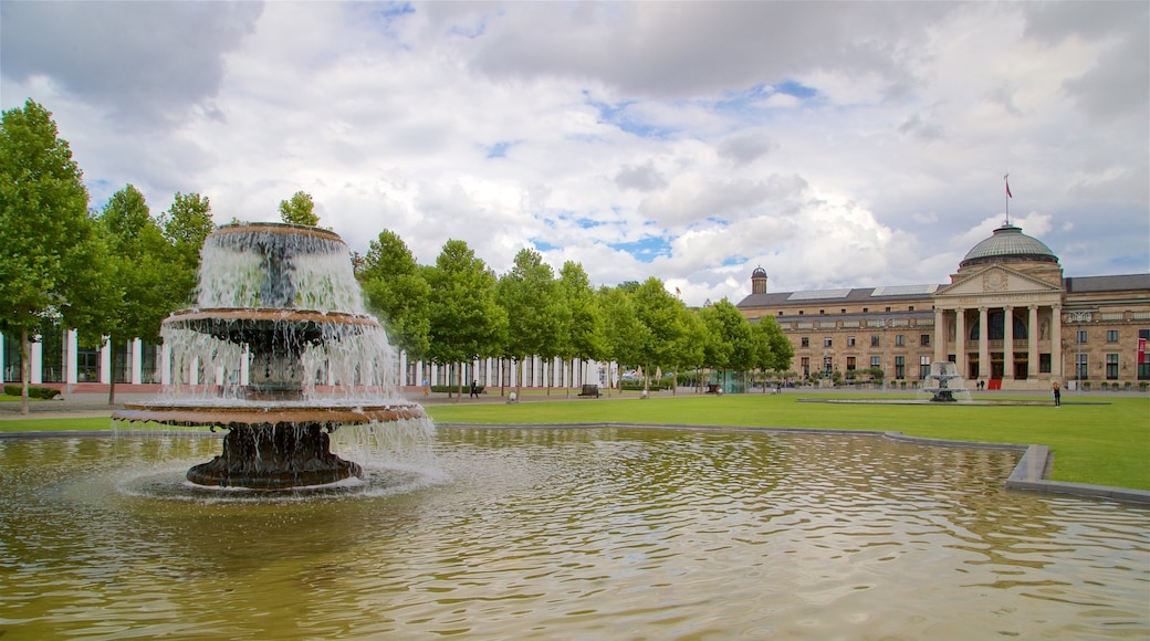 Kurhaus featuring a fountain, heritage architecture and a garden