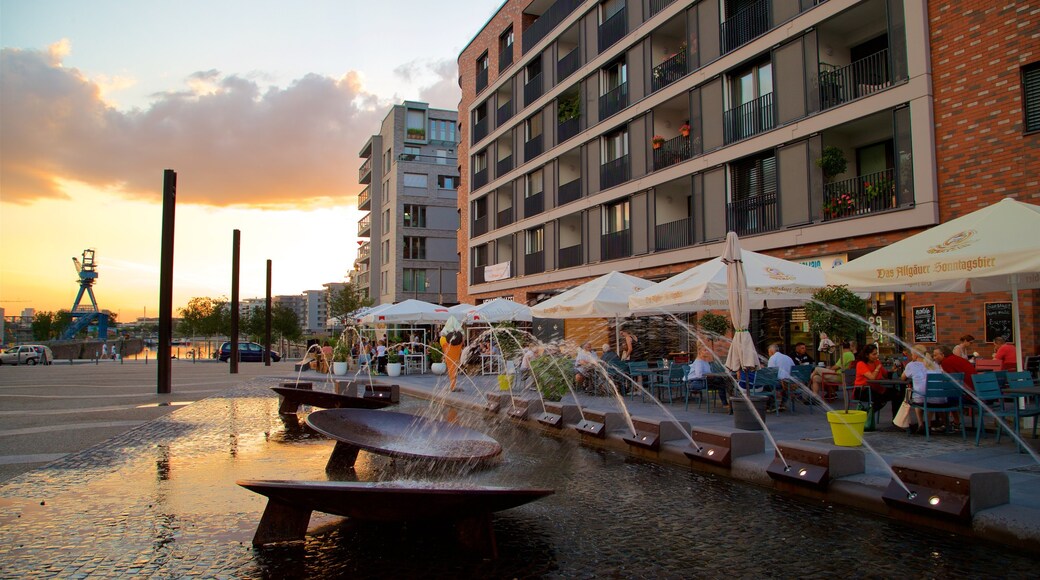 Offenbach am Main featuring a fountain, a sunset and outdoor eating