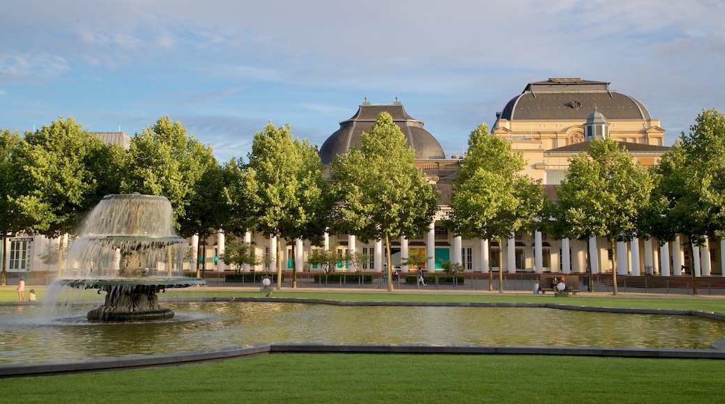 Hessian State Theatre featuring a fountain, a pond and a garden