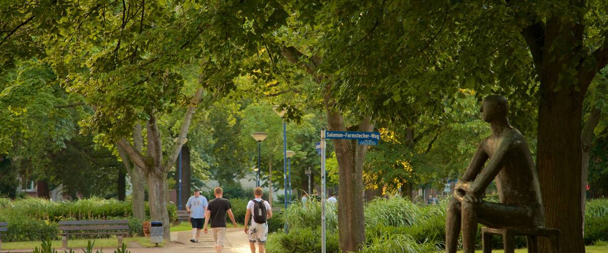 Offenbach am Main showing a garden and outdoor art as well as a couple