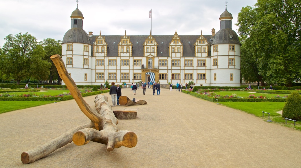 Neuhaus Castle which includes heritage architecture, flowers and a park