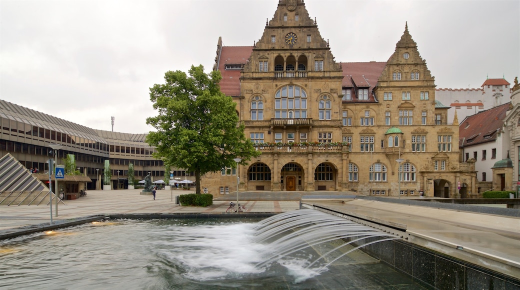 Old Town Hall which includes a fountain and heritage architecture