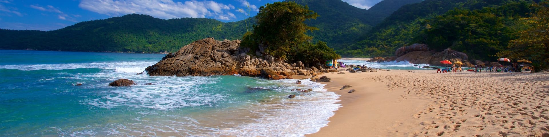 Meio Beach showing rugged coastline, a sandy beach and general coastal views