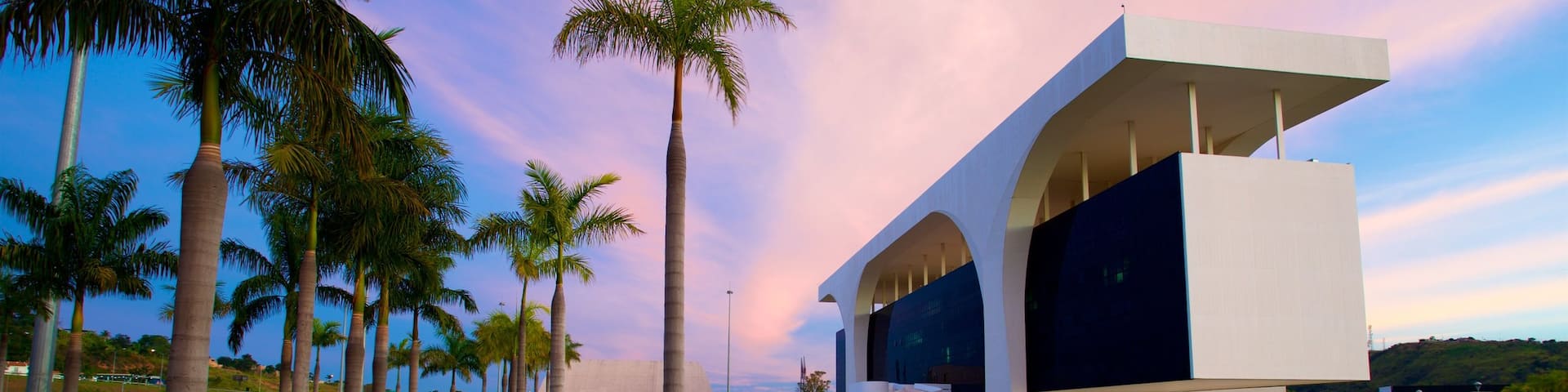 Belo Horizonte which includes modern architecture, a garden and a sunset