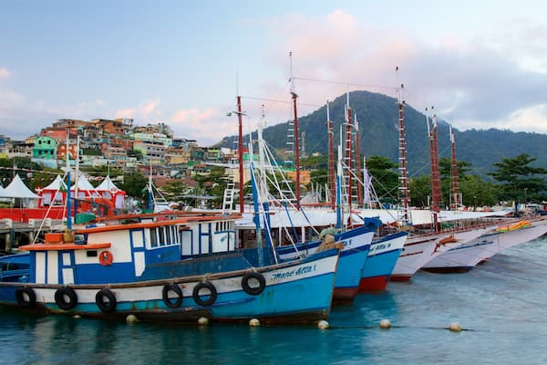 Cais Turistico de Santa Luzia featuring a bay or harbour and a coastal town