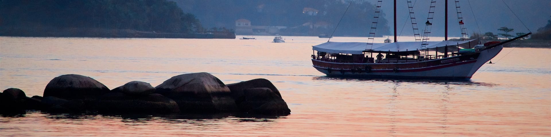 Angra dos Reis which includes boating, a bay or harbor and a sunset