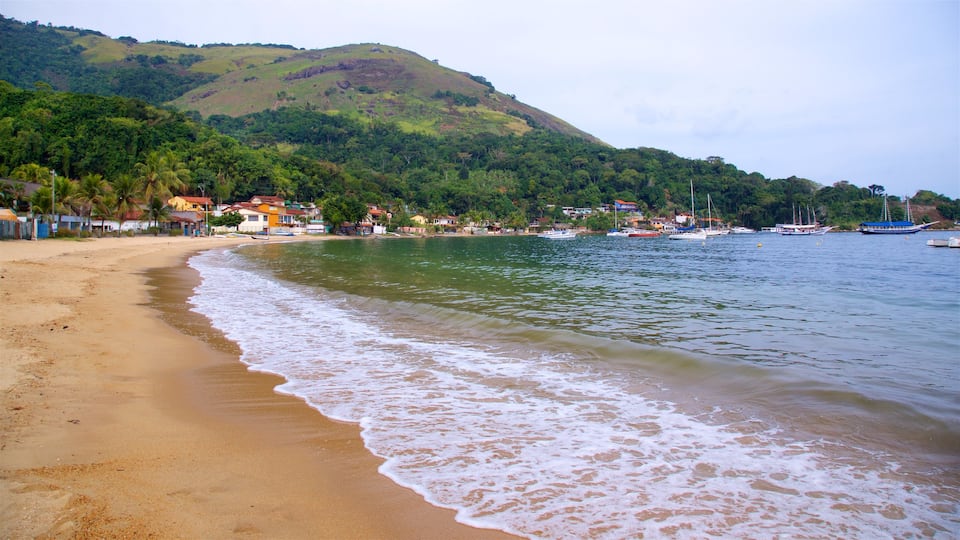 Biscaia Beach which includes a coastal town, general coastal views and a sandy beach