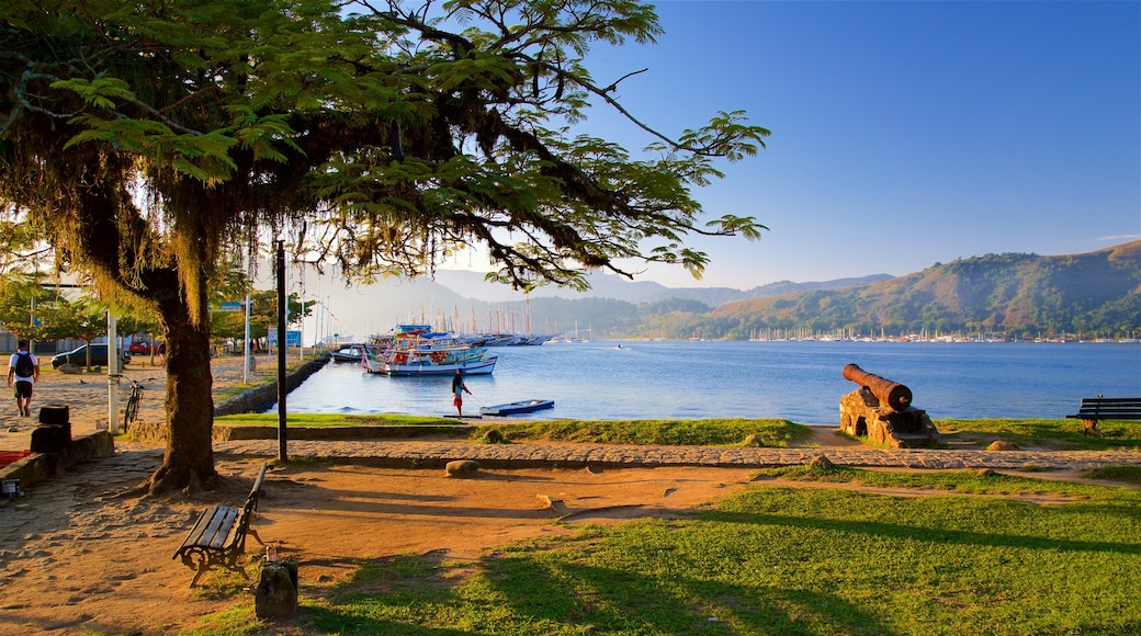 Bandeira Square featuring a sunset, a bay or harbour and heritage elements