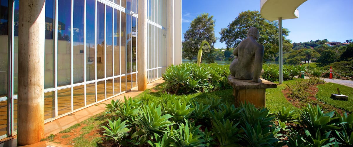Pampulha Art Museum featuring a garden and a statue or sculpture