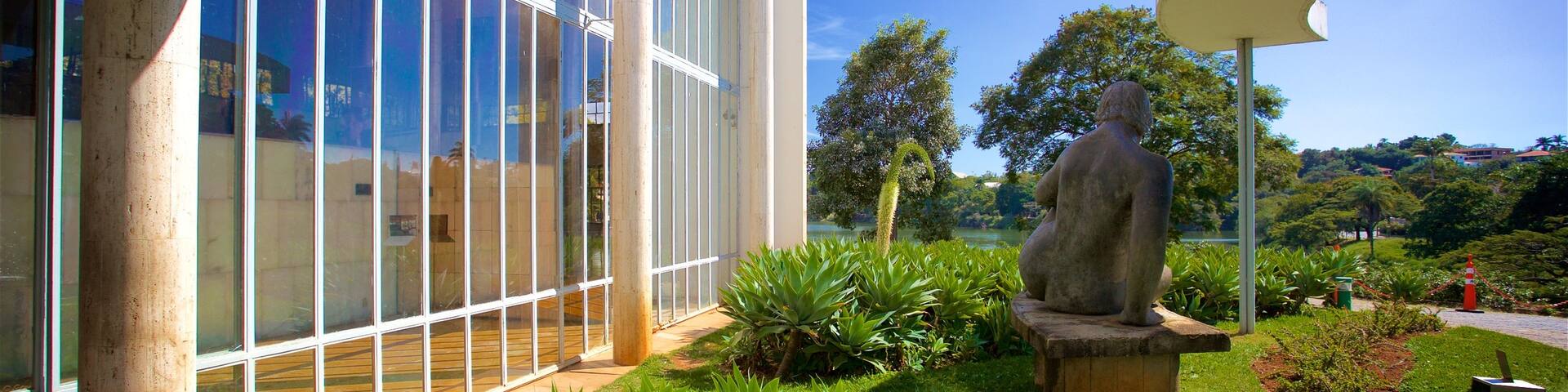 Pampulha Art Museum showing a garden and a statue or sculpture