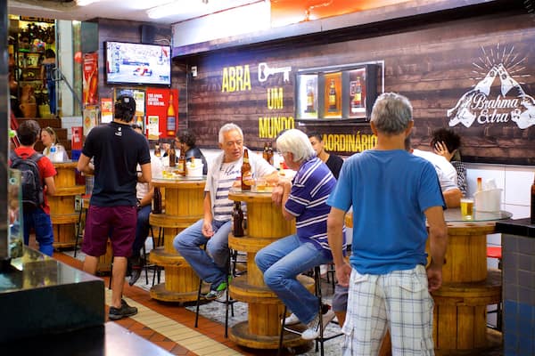 Central Market featuring dining out and interior views as well as a small group of people