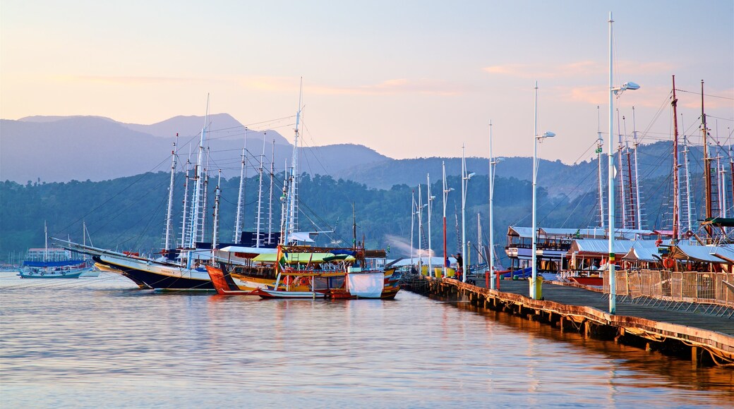 Paraty Wharf which includes a bay or harbour and a sunset