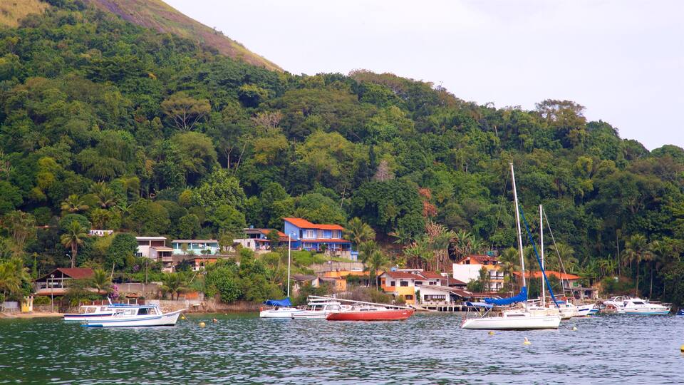 Biscaia Beach which includes a coastal town and a bay or harbour