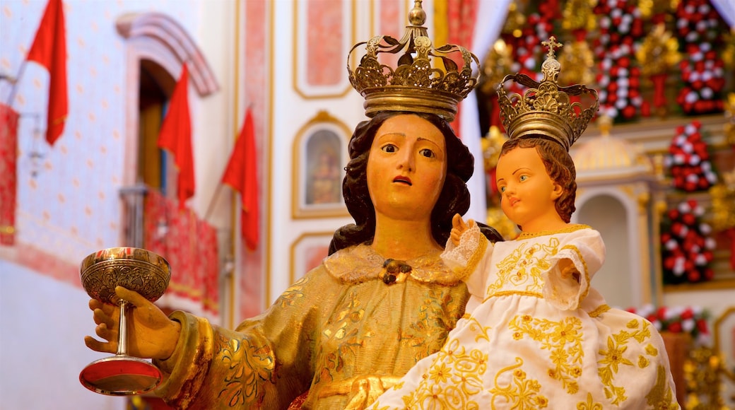 Iglesia de Nuestra Señora de los Remedios que incluye aspectos religiosos