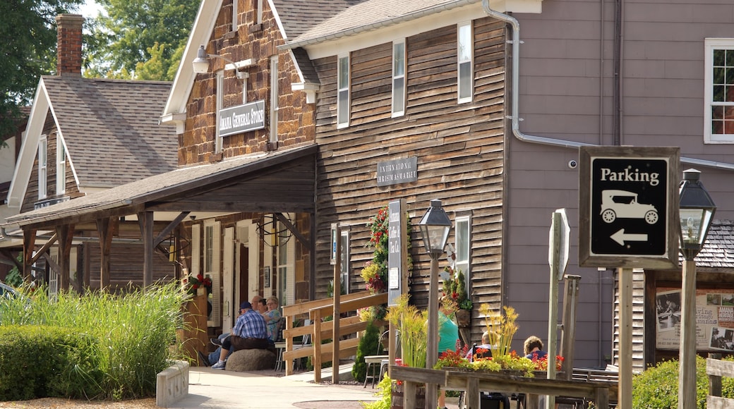 Amana Colonies showing a small town or village, a house and signage