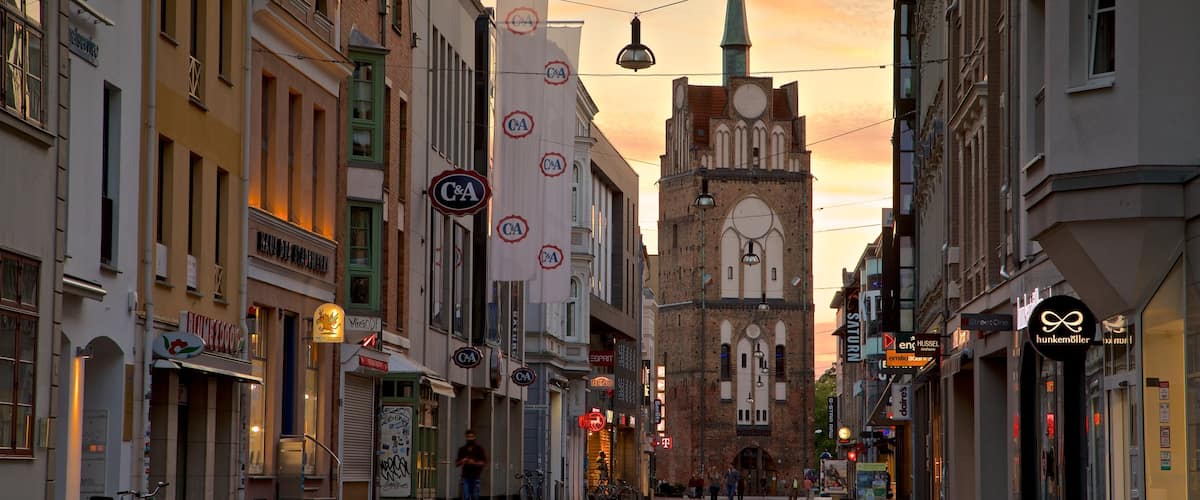 Kröpeliner Tor which includes a city, heritage architecture and a sunset