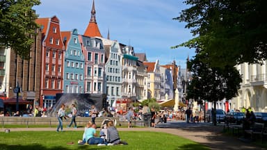 Rostock which includes a garden and a city as well as a small group of people