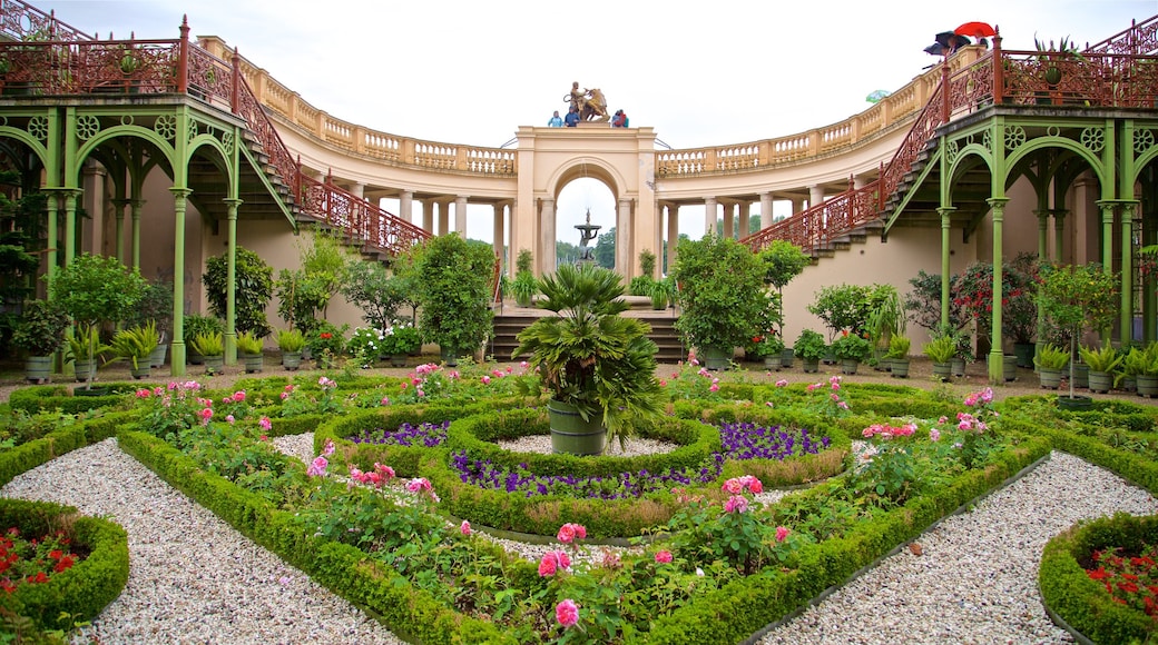 Schwerin Castle featuring flowers, a park and heritage elements