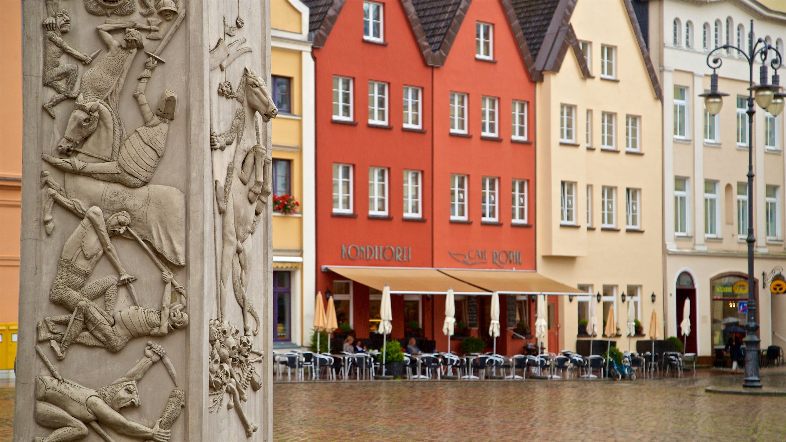 Schwerin which includes a city, a statue or sculpture and a square or plaza