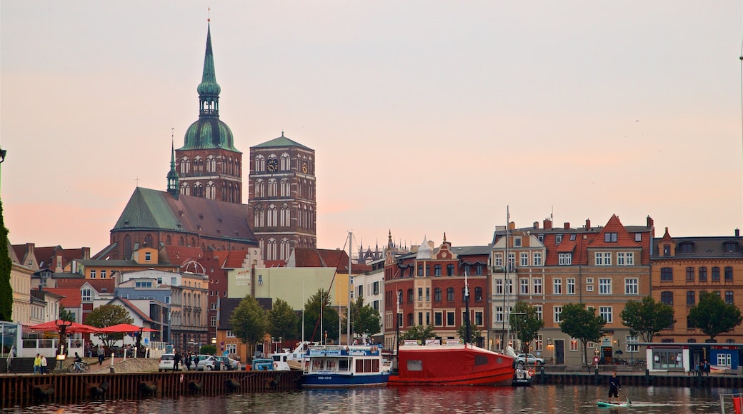 Stralsund Harbour showing heritage architecture, a sunset and a bay or harbor