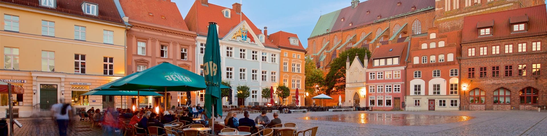 Stralsund showing a sunset, a square or plaza and a city