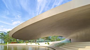 Volkswagen Autostadt Complex which includes modern architecture and a lake or waterhole