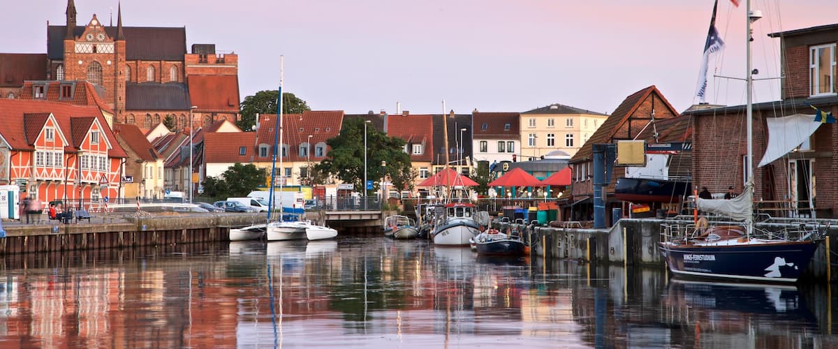 Wismar featuring a sunset and a bay or harbour