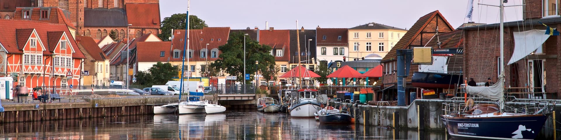 Wismar featuring a bay or harbor and a sunset