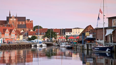 Wismar featuring a bay or harbor and a sunset