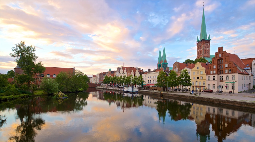 Petrikirche featuring a city, a bay or harbor and a sunset