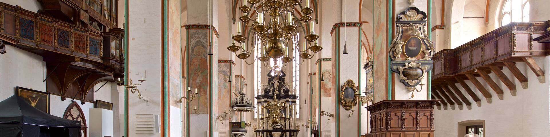 St. Jakobi Church featuring a church or cathedral, heritage elements and interior views