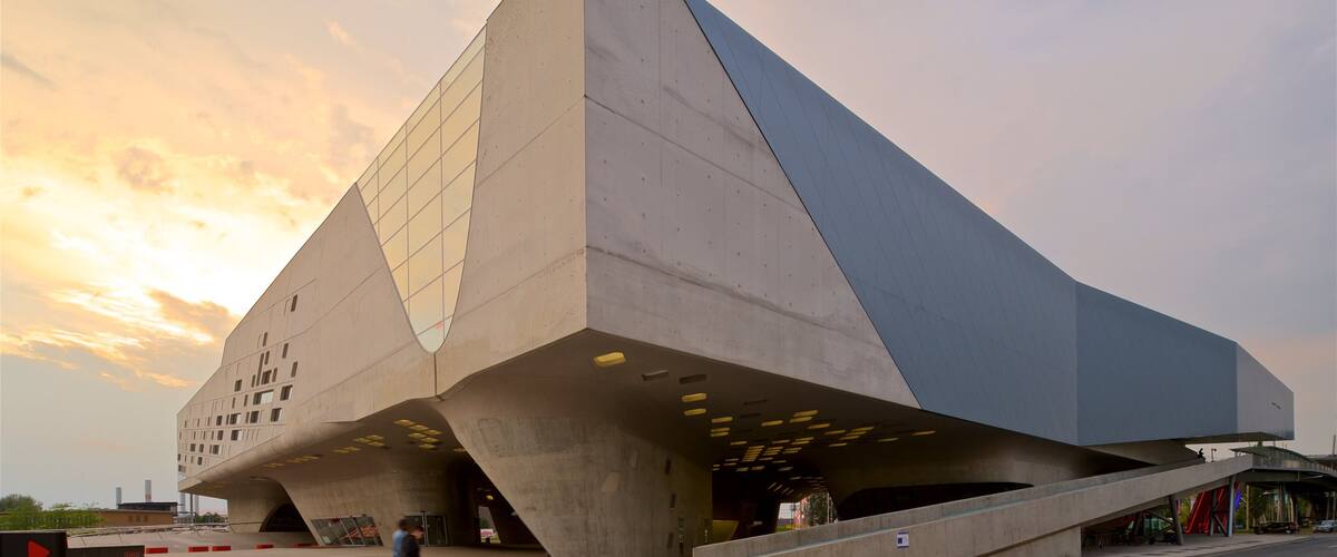 Phaeno Science Center featuring modern architecture and a sunset