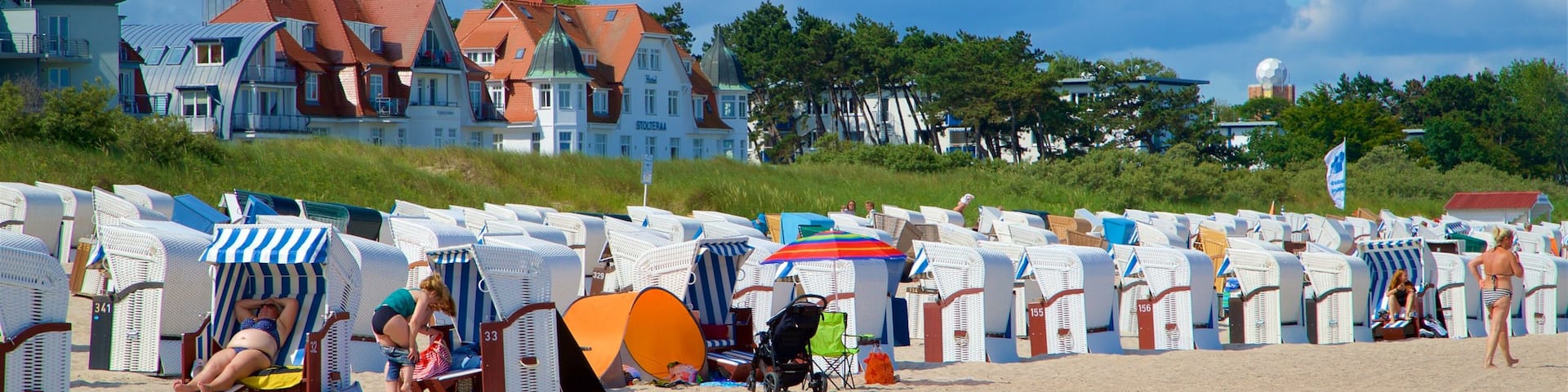 Warnemunde Beach which includes a sandy beach and general coastal views