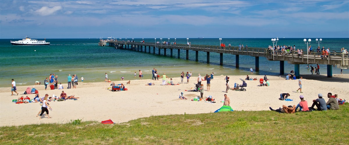 Binz Beach showing general coastal views and a beach as well as a small group of people