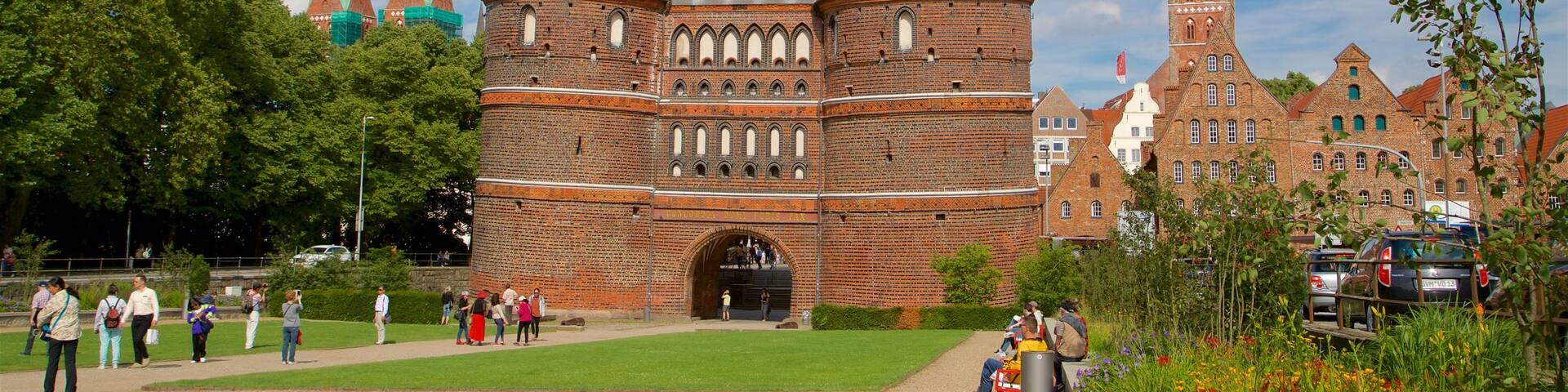 Museum Holstentor featuring wildflowers, a garden and heritage architecture
