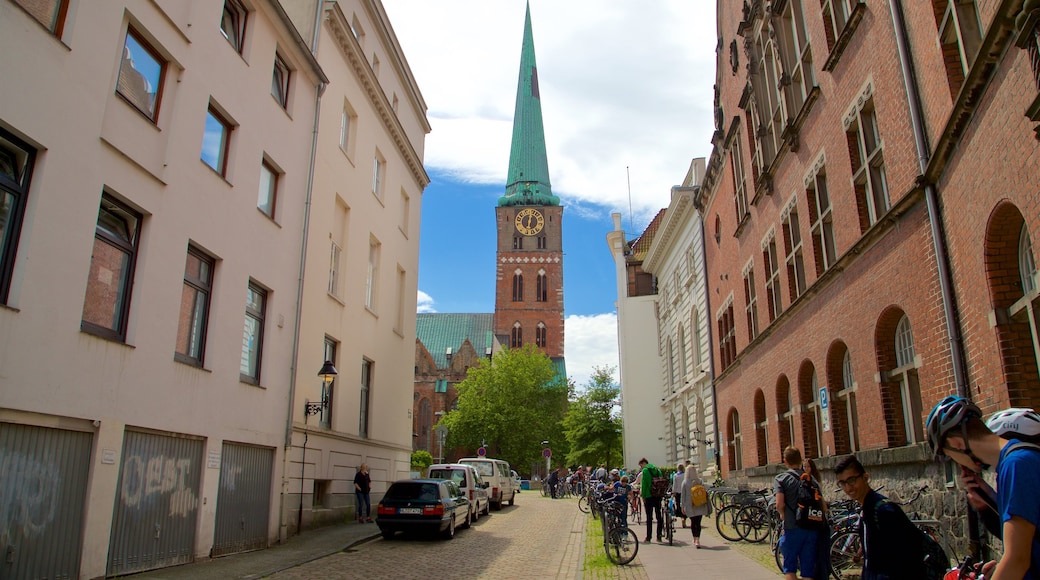 St. Jakobi Church featuring heritage architecture and street scenes as well as a small group of people