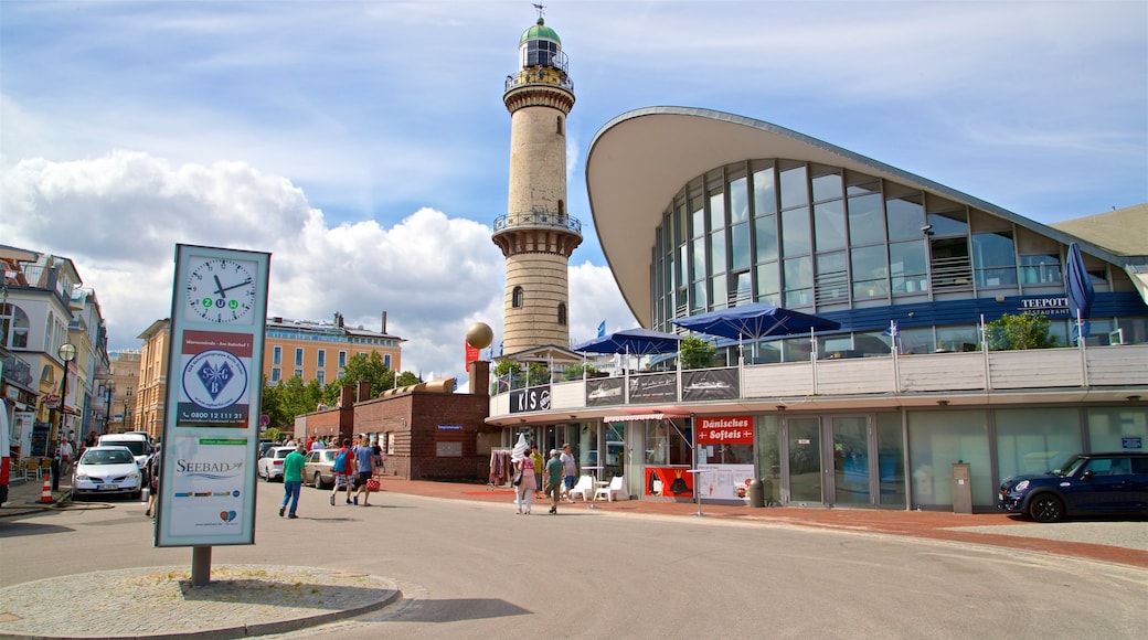 Warnemuende Lighthouse which includes signage, modern architecture and a lighthouse