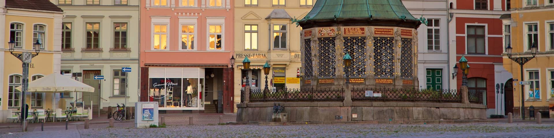 Wasserkunst featuring a city, a sunset and heritage elements