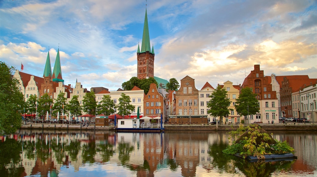 Petrikirche which includes a sunset, a river or creek and a city