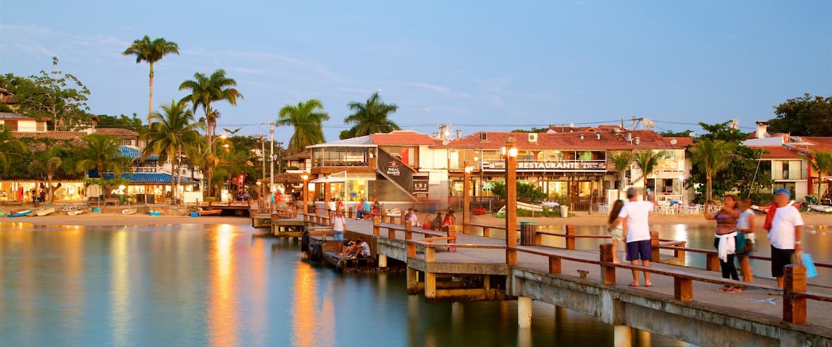 Buzios featuring general coastal views and a coastal town as well as a small group of people