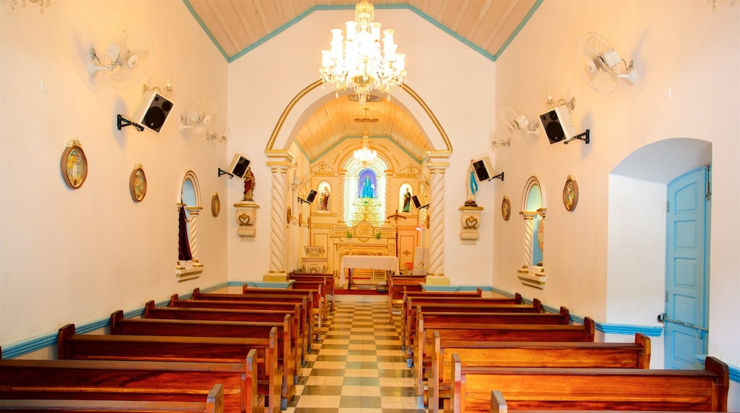 Our Lady of Remedies Church showing a church or cathedral and interior views