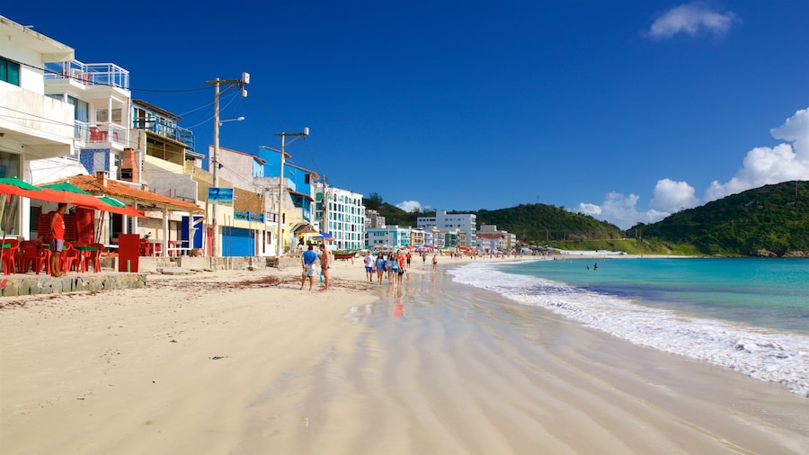 Prainha Beach which includes a coastal town, a beach and general coastal views