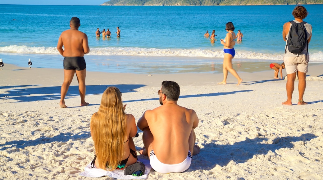 Pontal do Atalaia Beach showing general coastal views and a beach as well as a couple